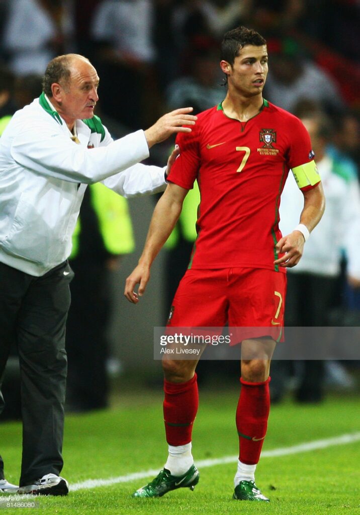 GENEVA - JUNE 07: Cristiano Ronaldo of Portugal receives instructions by head coach Luiz Felipe Scolari during the UEFA EURO 2008 Group A match between Portugal and Turkey at Stade de Geneve on June 7, 2008 in Geneva, Switzerland.  (Photo by Alex Livesey/Getty Images)